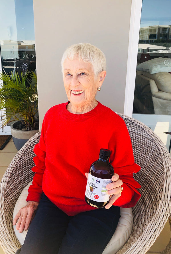 Old woman with Cold & Flu Remedy in Australia